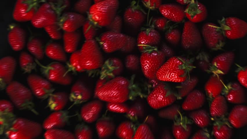 Strawberry background is jumping. Fresh juicy strawberries bouncing. Slow motion close up Royalty-Free Stock Footage #1104981253