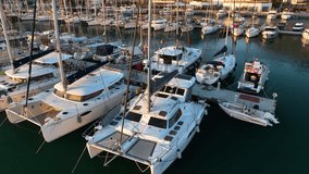 Aerial photography from a drone on top of many yachts and boats in the harbor. The drone smoothly Mediterranean Sea, Alanya,Turkey