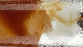 Iced coffee. Pour black coffee in glass with ice, extreme macro. Coffee drinks concept. Vertical video - Powered by Shutterstock - Get 15% off with code: PIKWIZARD15