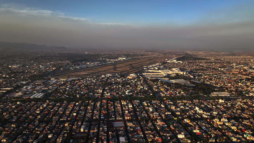 Aerial view of the Aeropuerto Internacional de la Ciudad de México, sunset in Mexico city