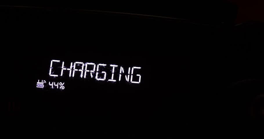 Charging sign on an lcd screen glowing in the dark