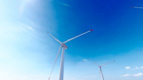 3840x2160. Close up of wind turbine with moving blades. Wind turbines produce clean renewable energy for sustainable development. Environmentally friendly energy. 3D Animation.