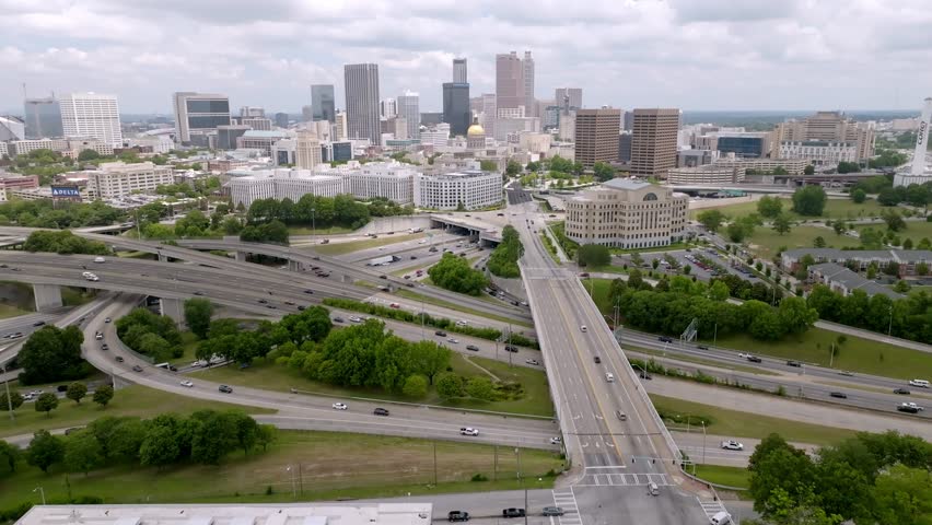 Atlanta, Georgia skyline and freeway traffic with drone video wide shot stable.