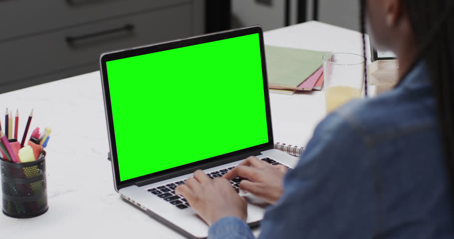 African american female student using laptop with copy space on screen. Communication, technology, school, learning and online education, digital composite video.