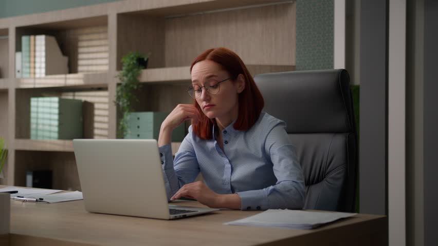 Bored sad Caucasian female office worker tired unmotivated business woman manager girl disinterested boring online laptop work lazy exhausted businesswoman feeling lack of motivation annoyed boredom Royalty-Free Stock Footage #1105014187