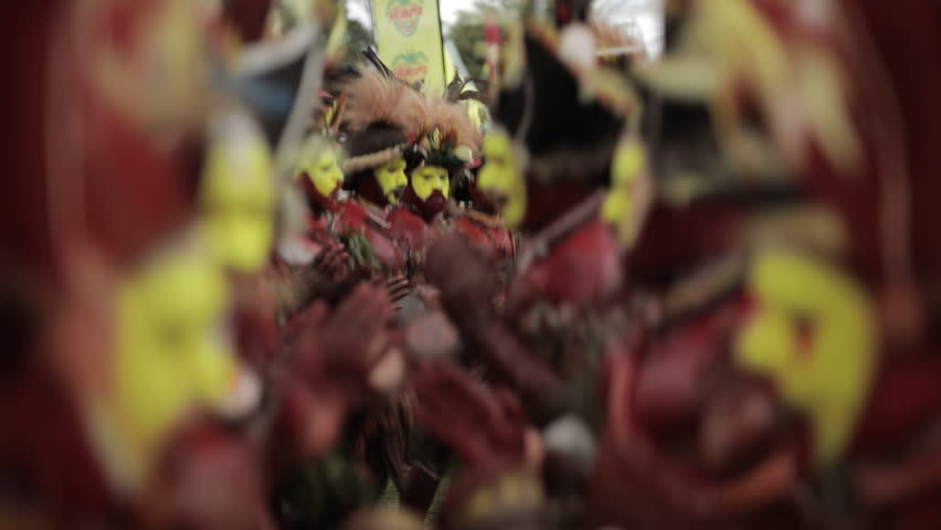 Goroka, Papua New Guinea - September 16, 2018: Goroka Show is a well-known tribal gathering and cultural event. Members of the tribe dance, sing and play traditional musical instruments.