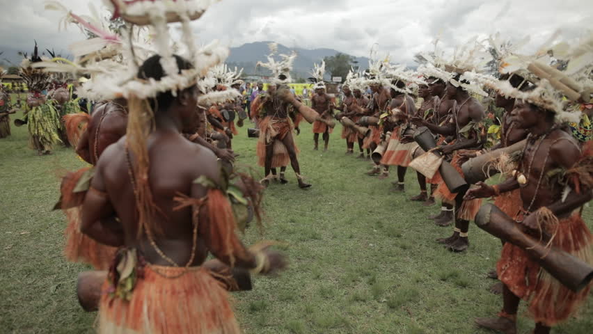 Goroka, Papua New Guinea - September 15, 2018: Goroka Show is a well-known tribal gathering and cultural event. Members of the tribe dance, sing and play traditional musical instruments.