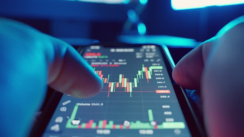 Cryptocurrency charts on mobile phone and computer monitor. Royalty-Free Stock Footage #1105019105