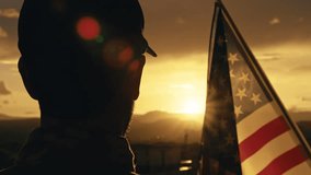 American soldier salutes sunset light - Powered by Shutterstock - Get 15% off with code: PIKWIZARD15
