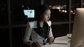 Young businesswoman in workplace discussing and consult planning with brainstorming meeting in office to night. Business woman planning and trading with negotiate partnership. - Powered by Shutterstock - Get 15% off with code: PIKWIZARD15