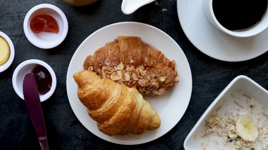 Eating a Croissant with Jam