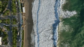 Tempestuous Seas: Cinematic Drone Captures the Power of a Strong Coastal Storm Along a Busy Highway