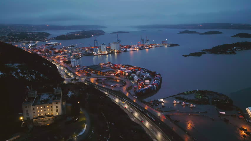 Aerial view of Oslo Downtown Skyline, Norway. Financial district and business centers in smart urban city in Europe. Skyscraper and high-rise buildings at night.