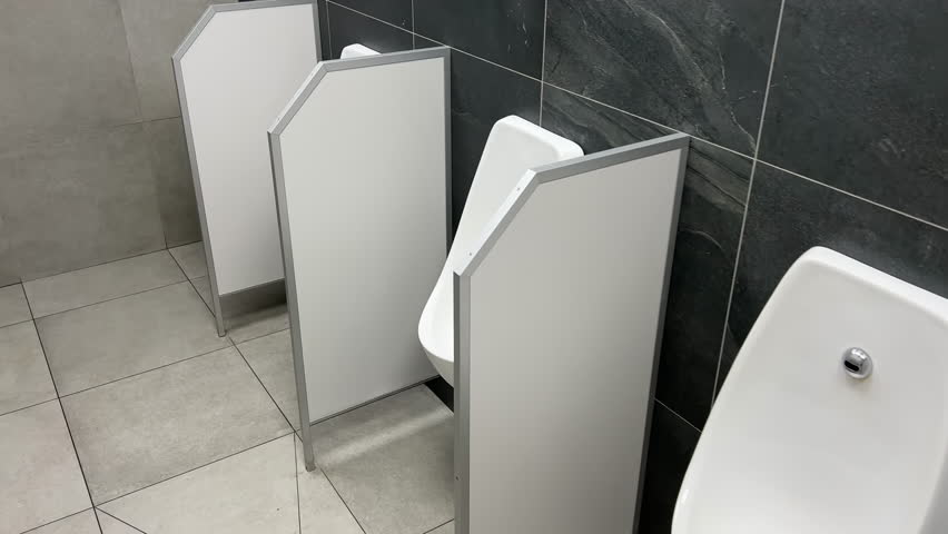 Rows of urinals in a public men