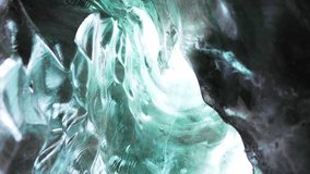 Blue ice mass in vatnajokull crevasse, majestic transparent ice glacier in iceland. Inside ice caves with cracked ice blocks covered in frost rocks, nordic landscapes. Handheld shot. - Powered by Shutterstock - Get 15% off with code: PIKWIZARD15