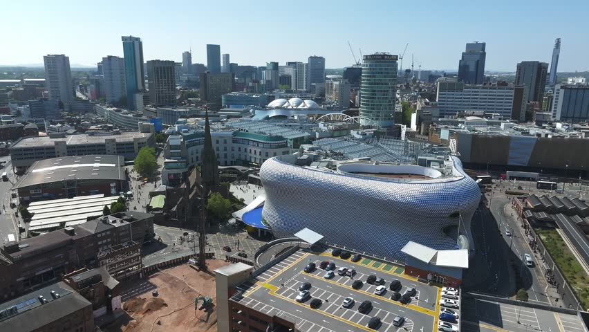 View of the skyline of Birmingham, UK including The church of St Martin, the Bullring shopping centre and the outdoor market.