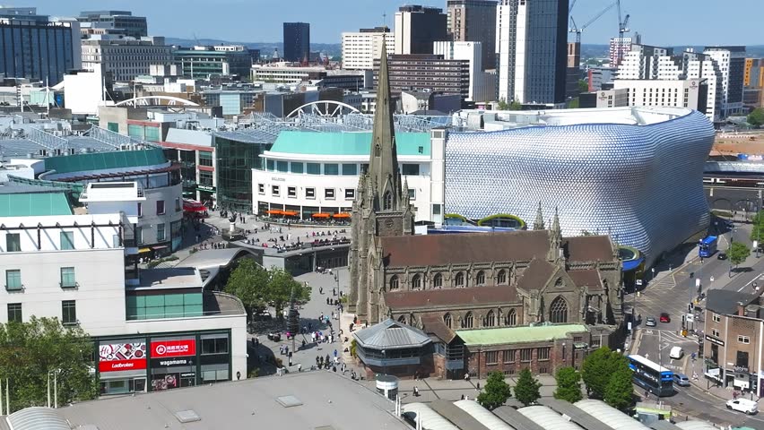View of the skyline of Birmingham, UK including The church of St Martin, the Bullring shopping centre and the outdoor market.