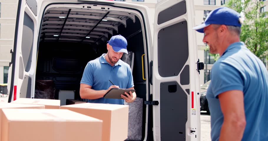 Mover Workers Near House Relocation Van. Professional Delivery Royalty-Free Stock Footage #1105046377