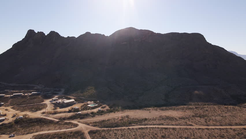 Aerial Drone Establishing Shot View of Mountain Dessert Zone of Big Bend National Park, Dry Landscape Panorama, Canyons and Settlements