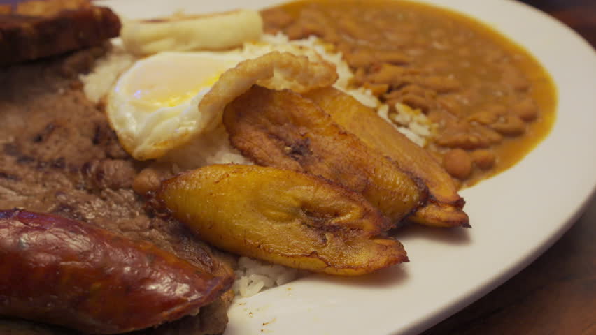 Tight shot of a plate of Colombian meal at a restaurant