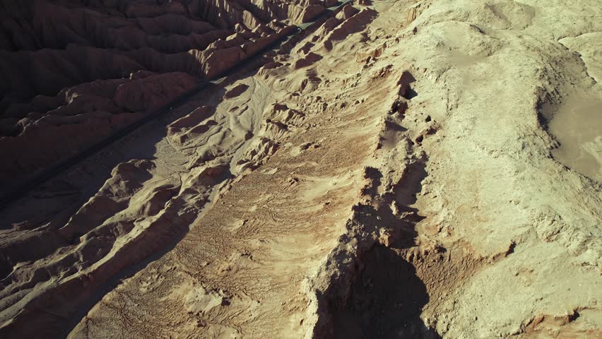 Dynamic Aerial Shot Revealing Valle de la Luna and Highway to San Pedro de Atacama, Chile.
