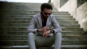 Man Using Smart Watch Wearable Wristband Device. Male Checking Pulse Smartwatch App. Businessman Scrolling On Display On Smartwatch Notification. Touch Screen Wearable Technology Smart Band On Wrist  - Powered by Shutterstock - Get 15% off with code: PIKWIZARD15