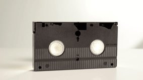 A black old VHS cassette with family recordings