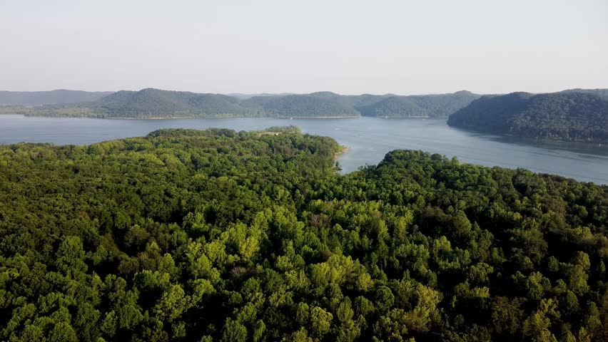 Drone flying over Daniel Boone National Forest towards Cave Run lake in Northeast Kentucky