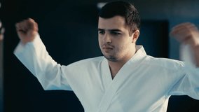 Young man warming up before practicing martial art, taekwondo practitioner - Powered by Shutterstock - Get 15% off with code: PIKWIZARD15