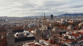 Bird's-eye view of residential areas, roads and sights of Barcelona, drone video