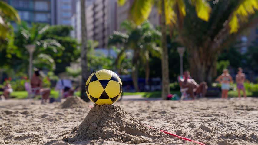 Close up video man kicking the soccer ball in slow motion. Seving the ball during futvolley match. Brazilian football. Royalty-Free Stock Footage #1105067397