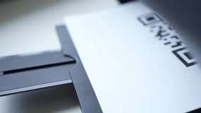 Printer printing a QR code on a paper. Closeup shot. - Powered by Shutterstock - Get 15% off with code: PIKWIZARD15