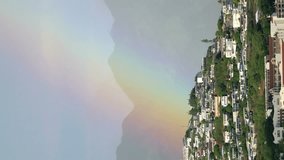 Vertical video of beautiful rainbow above Honolulu Hawaii in 4k slow motion 60fps - Powered by Shutterstock - Get 15% off with code: PIKWIZARD15