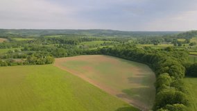 This aerial drone video shows the countryside and meadows in the beuatiful national park of Kent Downs, south England. 