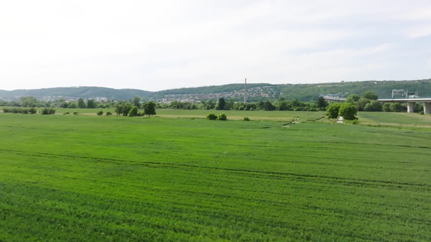 Highway overpass over fields aerial drone footage in summer