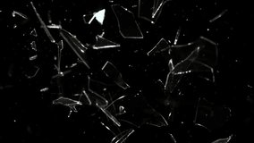 Super Slow Motion studio full-frame wide plate shot of window glass pane shattering and breaking on black background. Real smash explosion at high speed as action concept template and overlay element. - Powered by Shutterstock - Get 15% off with code: PIKWIZARD15