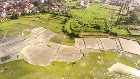 Aerial Footage. Aerial shot of residential areas around agricultural fields in the Bandung area, Indonesia