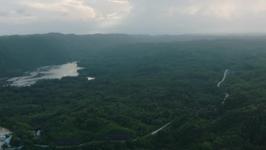 Aerial view of Tropical mountain range and river in rainforest. Mindanao, Philippines.