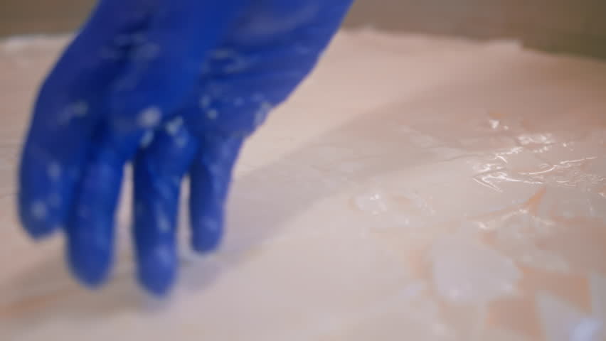 milk mixing at cheese factory cheese maker checks by hand in large tank Pasteurization Cheese production cheese factory