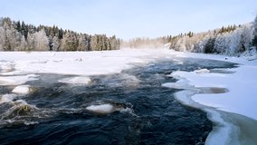Winter river Landscape, water vapour coming from water flow. Landscape With Snowy Trees, Beautiful Frozen River With Reflection In Water. Water in frozen stream. Snowy river in forest. - Powered by Shutterstock - Get 15% off with code: PIKWIZARD15