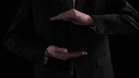 the hands of a man in a suit shows a triangle sign on a black background - Powered by Shutterstock - Get 15% off with code: PIKWIZARD15