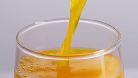 Close Up Of Orange Juice Being Poured Into A Glass On The Light White Screen Background In The Studio
 - Powered by Shutterstock - Get 15% off with code: PIKWIZARD15