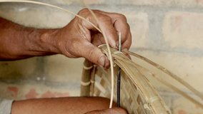 skilled asiatic male hands close up artisan making hat from bamboo stick  - Powered by Shutterstock - Get 15% off with code: PIKWIZARD15