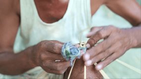 craftsman indian asian artisan close up making hand made product with bamboo stick  - Powered by Shutterstock - Get 15% off with code: PIKWIZARD15