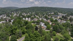 Neighborhood in Williamsport, Pennsylvania with drone video moving down.