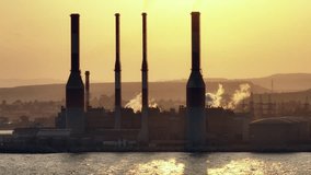 Aerial view of toxic waste entering the air and sea from the power plant. The production of non-environmental electricity is a danger to the environment and life on the planet. High quality 4k footage