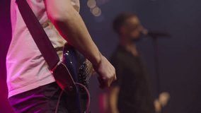 Electric bass guitar player hands. Live music. Slow motion - Powered by Shutterstock - Get 15% off with code: PIKWIZARD15