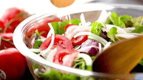 Fresh and Vibrant: Close-Up of Mixing Fresh Vegetable Salad in Stunning 4K Resolution