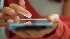 Cinematic close up Girl scrolling pages in mobile app on cell phone device. Browsing movie video on internet library to watch film online. Slow motion woman fingers touching modern smartphone screen - Powered by Shutterstock - Get 15% off with code: PIKWIZARD15