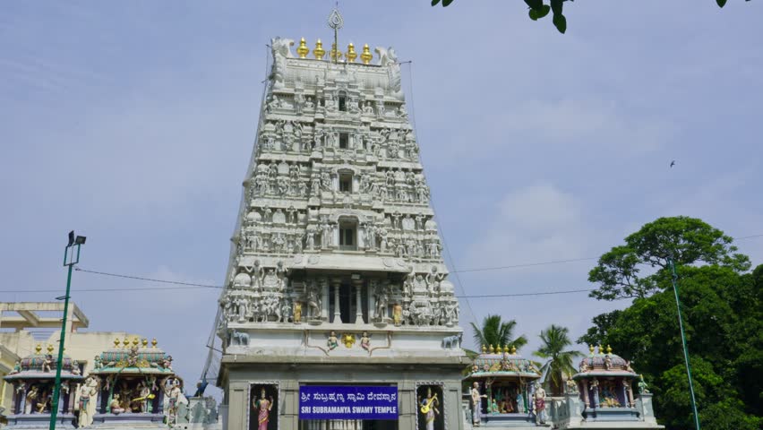 The Indian Hindu temple features a Shikhara (tower) in its architectural design adorned with sculptures of gods and goddesses